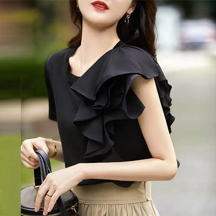 Elegant ruffled blouse with seams