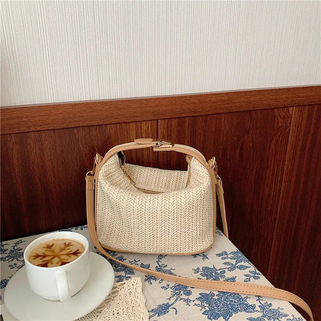 Ladies boho style knitted straw crossbody bag bucket design with zip fastening