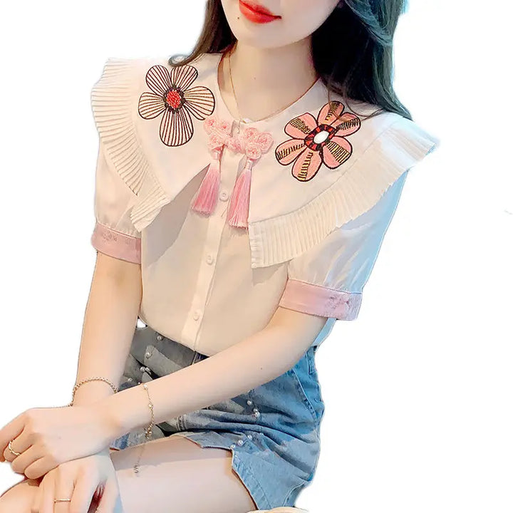 Fashionable summer blouse with embroidery and short sleeves