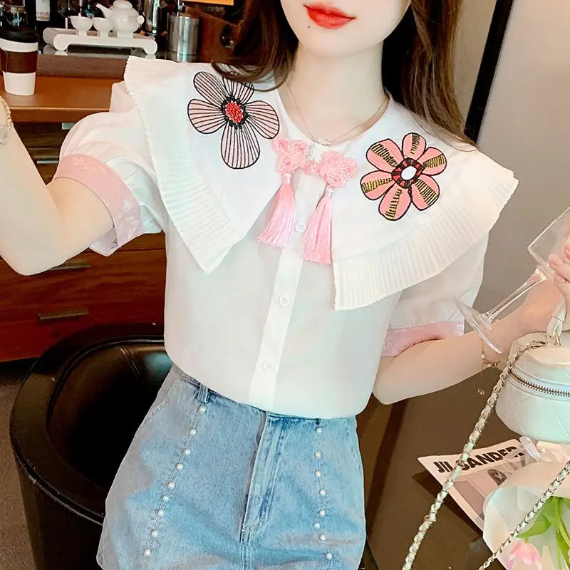 Fashionable summer blouse with embroidery and short sleeves