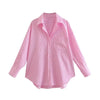 Striped, loose-fitting women's shirt: long-sleeved button blouse with pocket