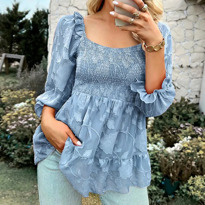 Ruffled blouse with a square neckline and sheer sleeves