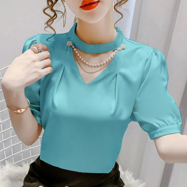 Summer blouse with puff sleeves and pearl embellishment