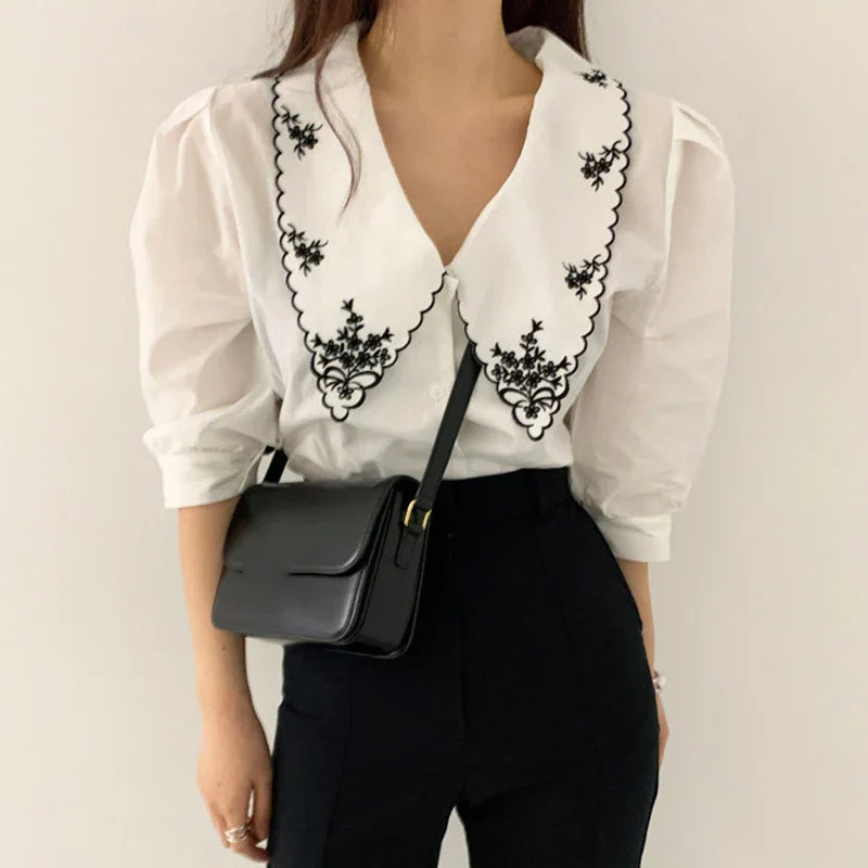 Lace blouse with floral embroidery