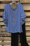 Ruffled cotton blouse with a round neckline