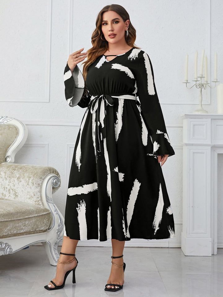 Ladies Fashionable Black And White Cut Out Flared Dress