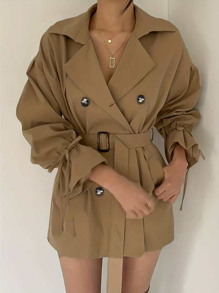 Mid-length, double-breasted trench coat with collar and belt