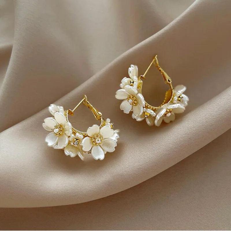 Flower hoop earrings with crystal centres