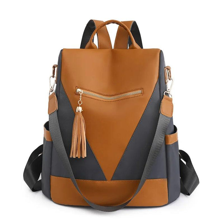 Backpack in two-colour look with tassel pendant