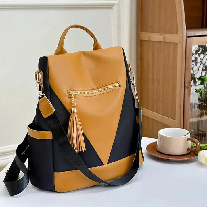 Backpack in two-colour look with tassel pendant