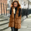 Hooded waistcoat with faux fur