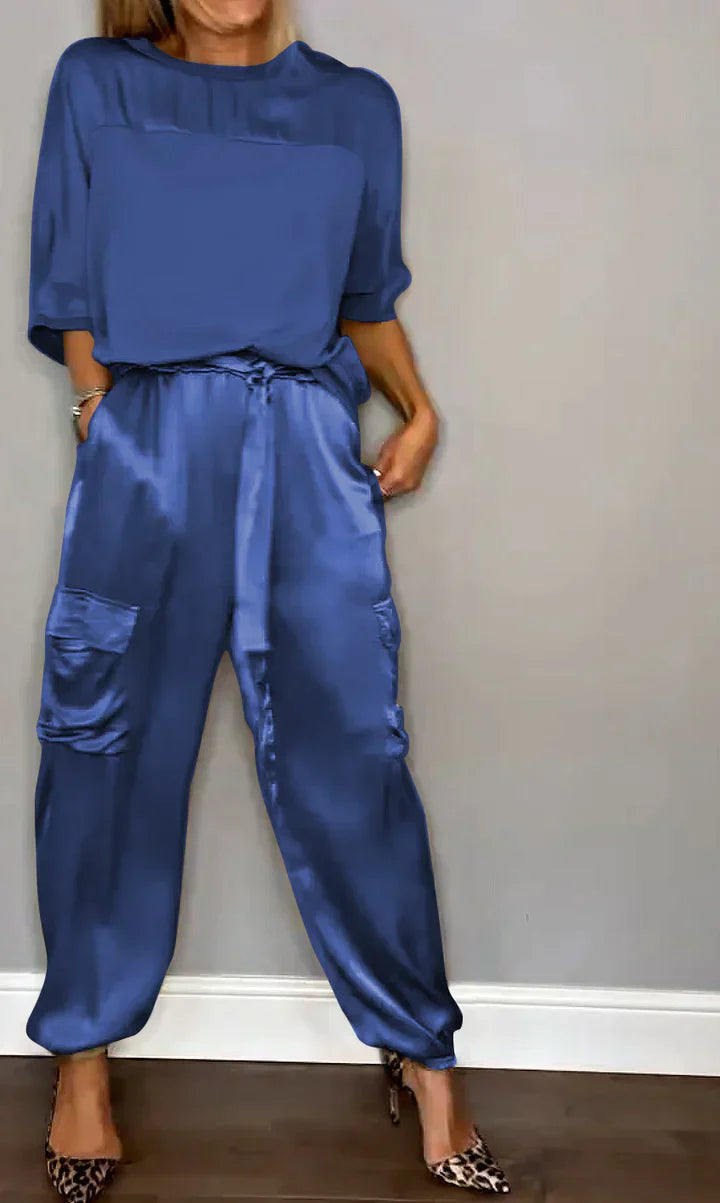 Two-piece suit in smooth satin with half-length top and trousers for women