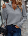 Women's jumper with V-neck, high-quality fabric and zip detail