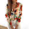 Long-sleeved shirt with floral buttons