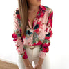 Long-sleeved shirt with floral buttons