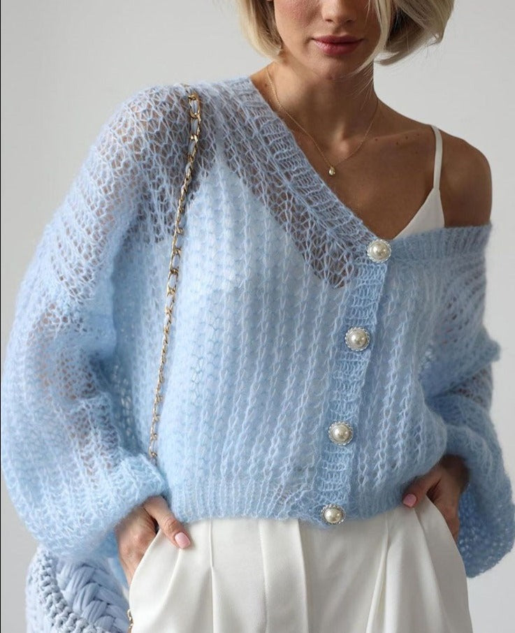 Light-coloured cardigan in light blue with pearl buttons