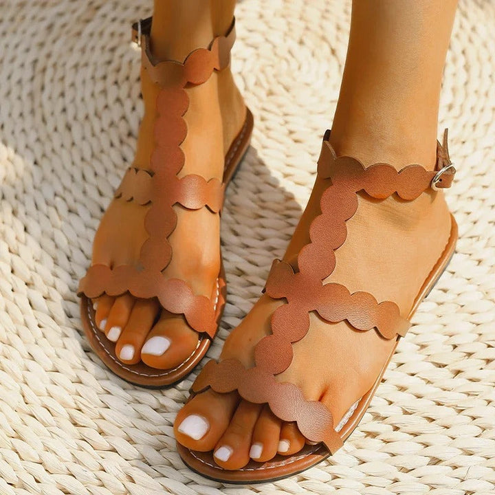 Sandals with scalloped edges