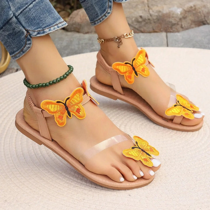 Flat sandals with butterfly decoration for women