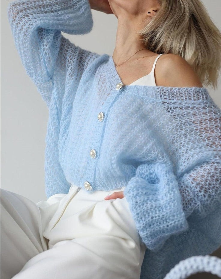 Light-coloured cardigan in light blue with pearl buttons