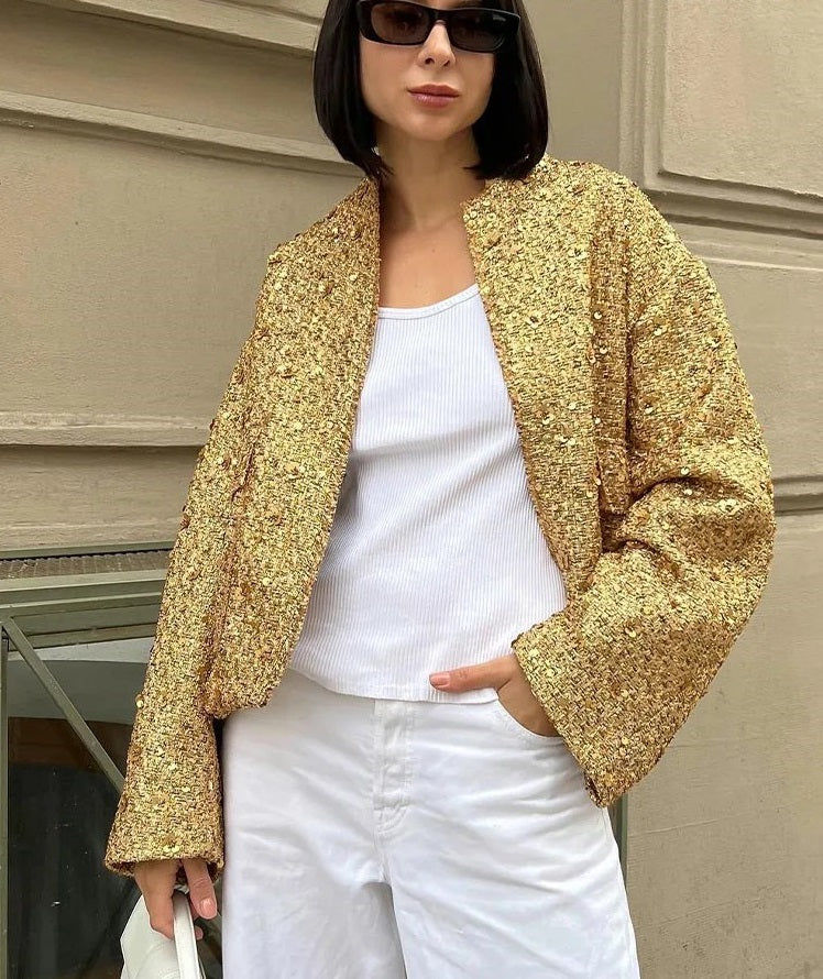 Chic, oversized coat with gold-coloured sequins.