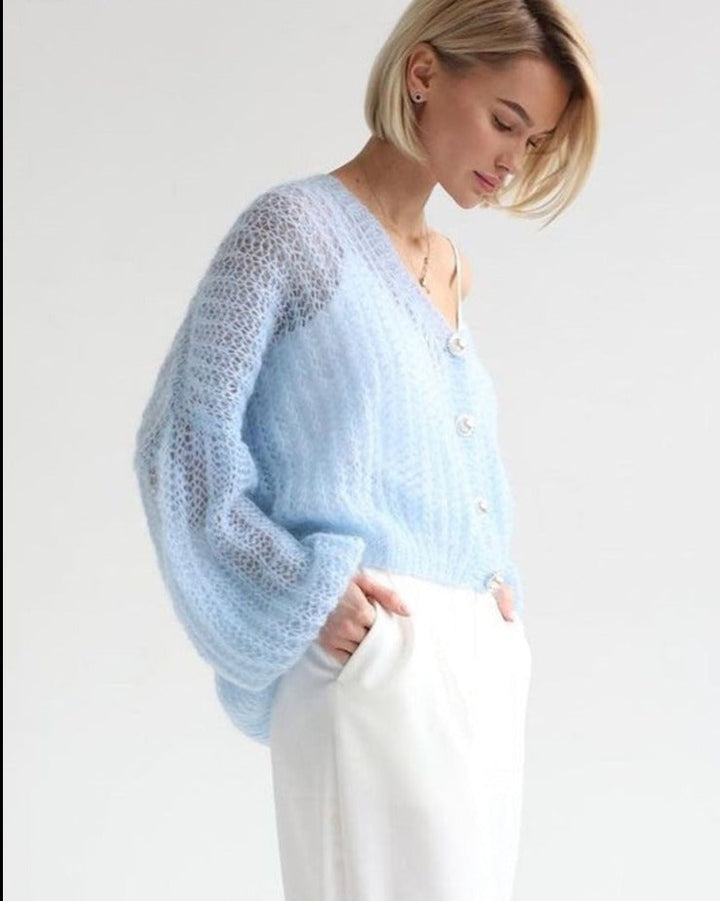 Light-coloured cardigan in light blue with pearl buttons