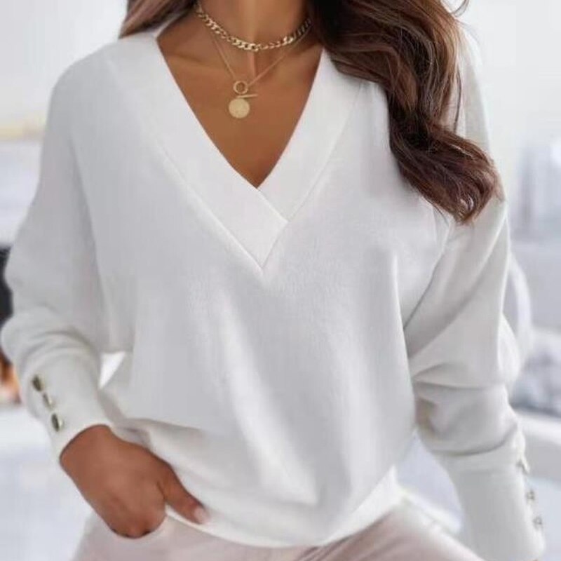 Elegant women's jumper with V-neck and gold buttons