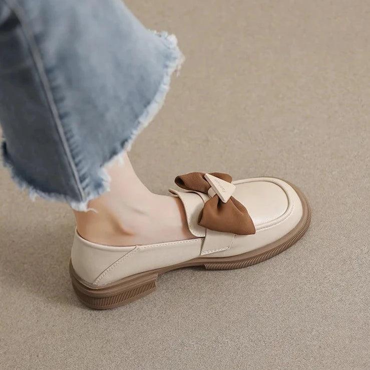 Elegant slip-on shoes with bow accent