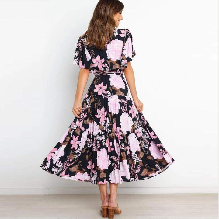 Floral wrap dress in midi length with flutter sleeves