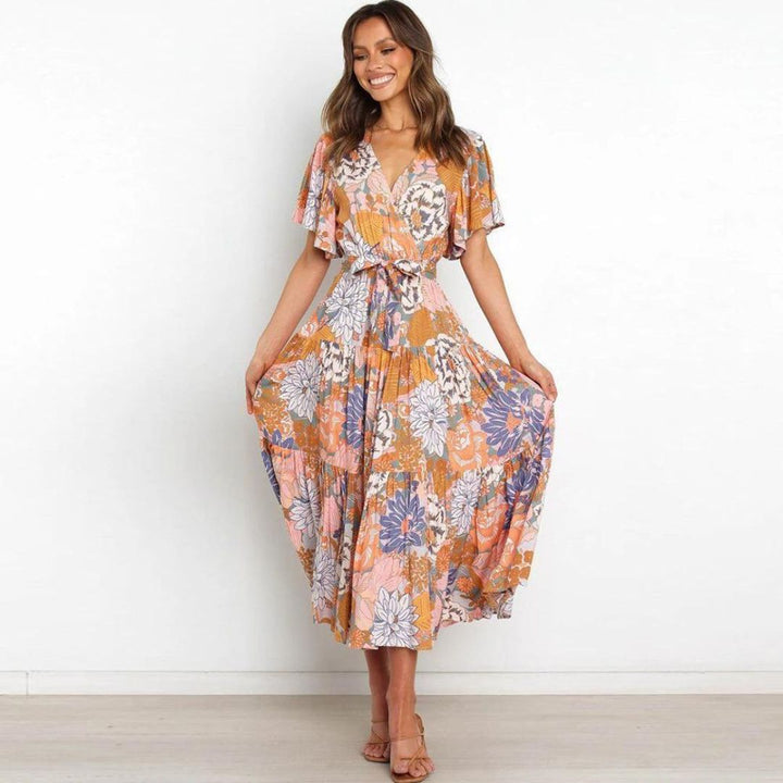 Floral wrap dress in midi length with flutter sleeves