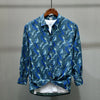 Shirt with turn-down collar and striking feather print