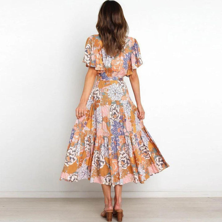 Floral wrap dress in midi length with flutter sleeves