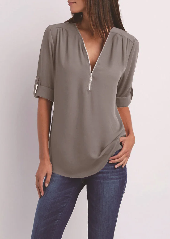 Blouse with V-neck and zip fastening