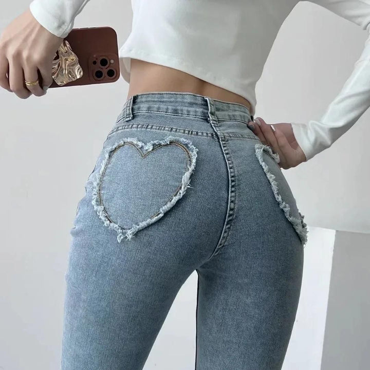 Stylish high-waisted jeans with heart-shaped fringe detail