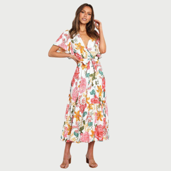 Floral wrap dress in midi length with flutter sleeves