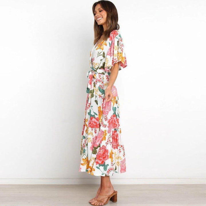 Floral wrap dress in midi length with flutter sleeves