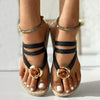 Braided sandals with floral embellishment