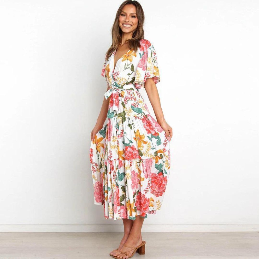 Floral wrap dress in midi length with flutter sleeves