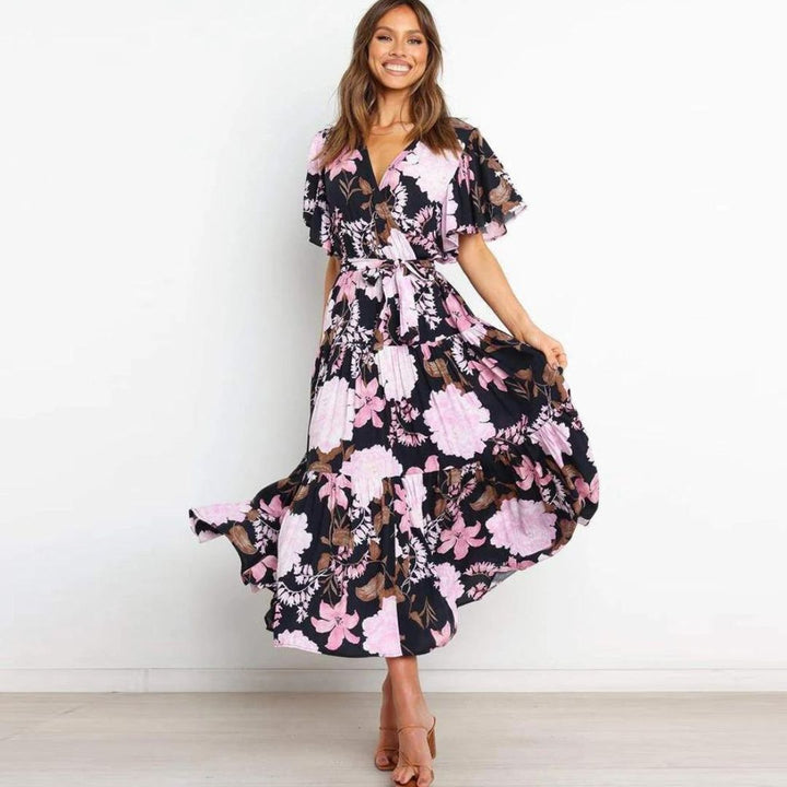 Floral wrap dress in midi length with flutter sleeves