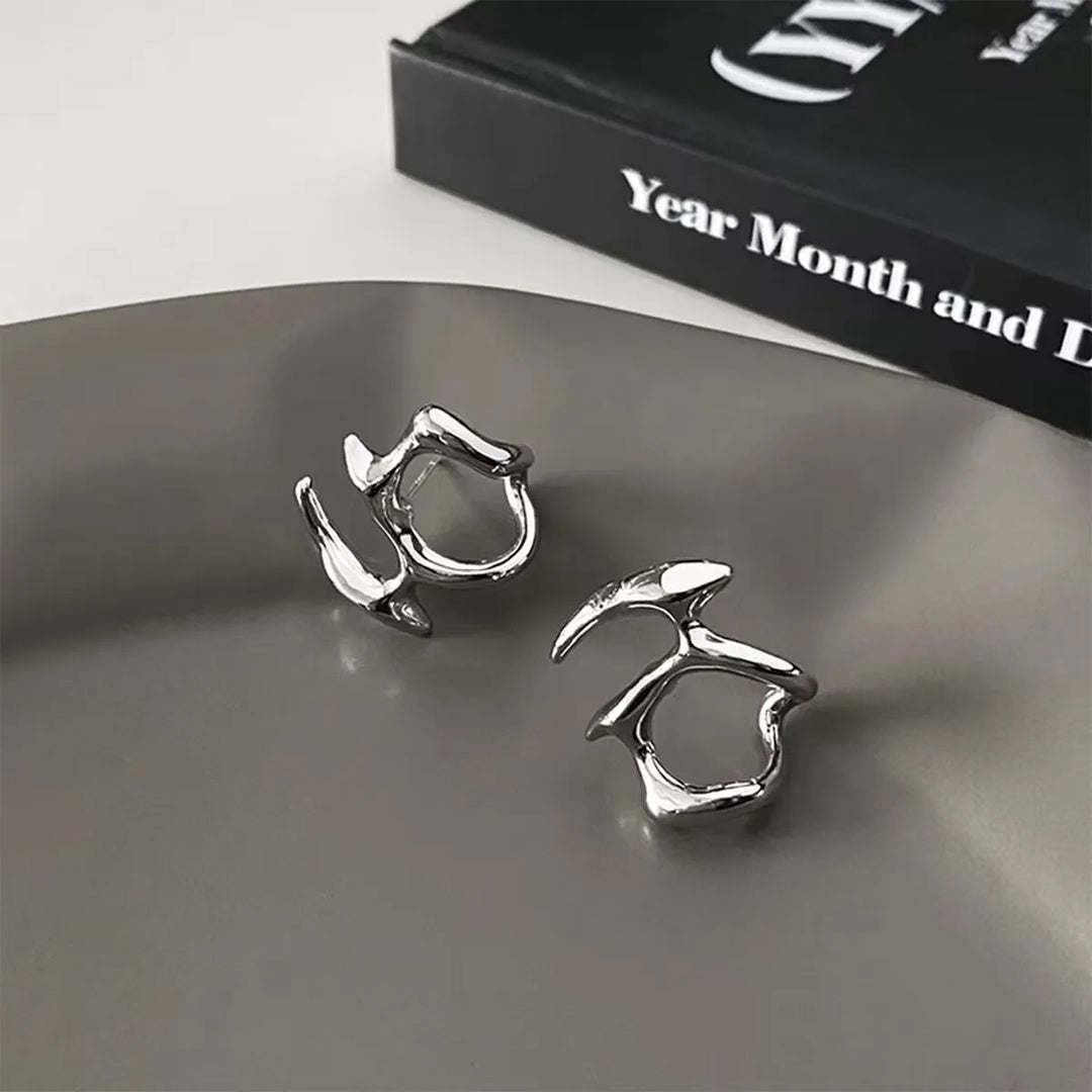 Star-shaped zirconia earrings with cross detail