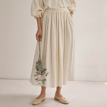 Vintage-inspired blouse and pleated midi skirt set