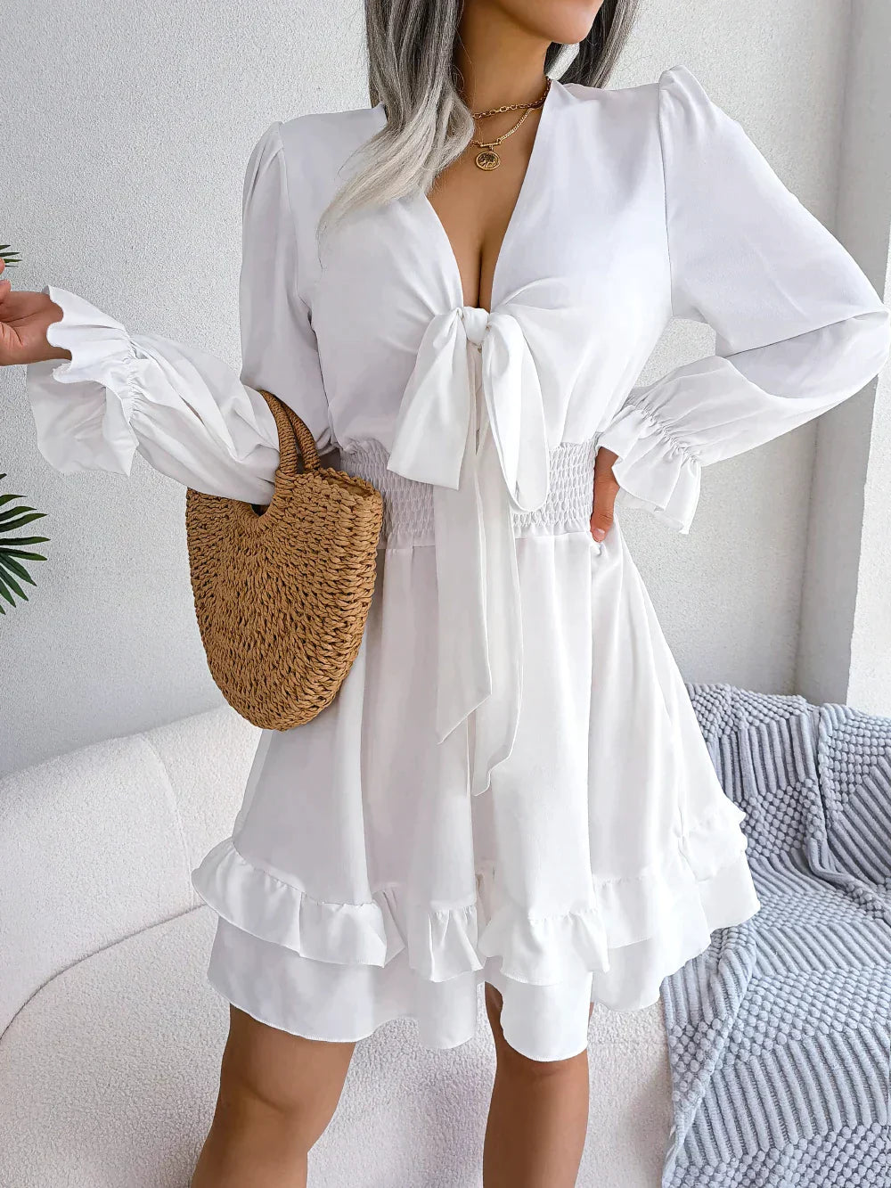 Dress with plunging neckline and ruffles