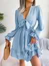 Dress with plunging neckline and ruffles