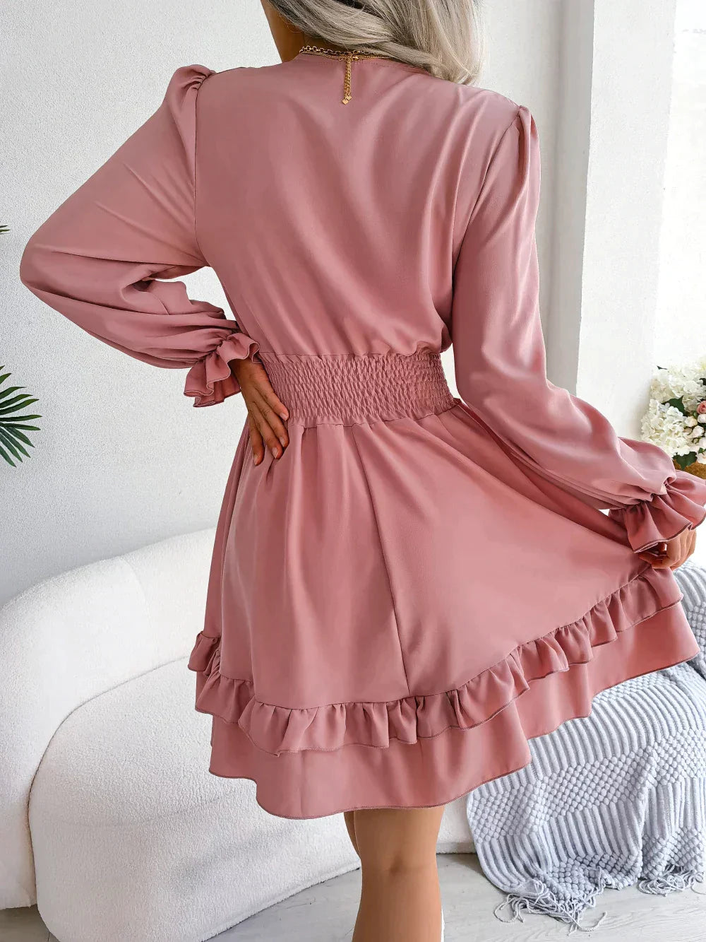 Dress with plunging neckline and ruffles