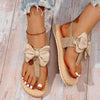 Sandals with large bow and braided details