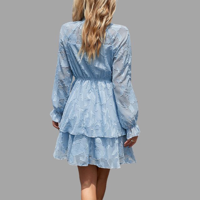 Flowing tiered mini dress with embossed floral detail