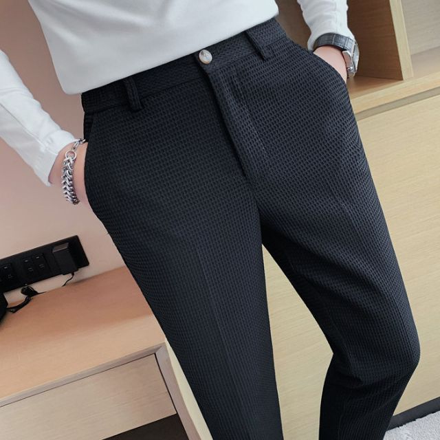 Slim-fit trousers with a subtle checked pattern