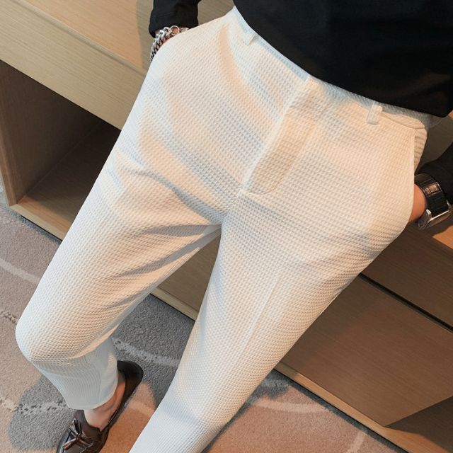 Slim-fit trousers with a subtle checked pattern