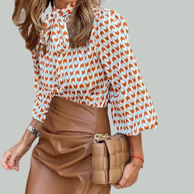 Houndstooth print blouse with high collar