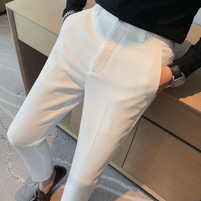 Slim-fit trousers with a subtle checked pattern