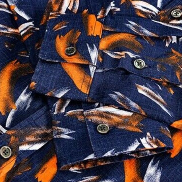 Shirt with turn-down collar and striking feather print